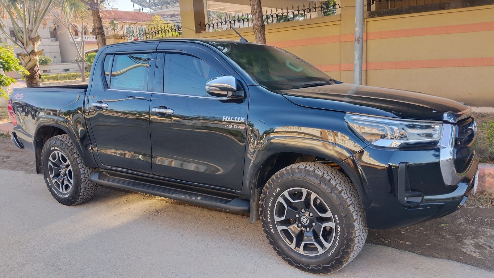 Black Toyota Hilux Revo rent a car with driver