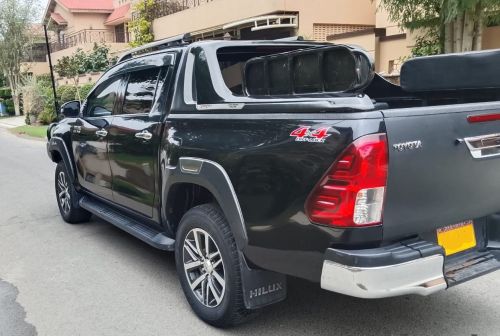Armored Toyota Hilux Revo Rocco Vigo for rent in Karachi - black rear 4x4