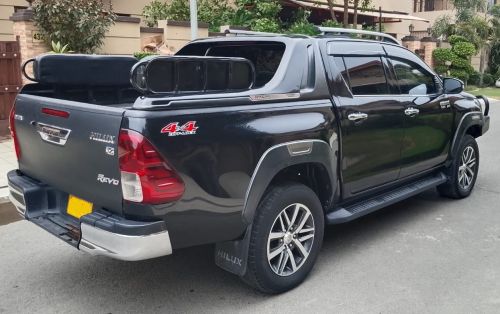 Armored Toyota Hilux Revo Rocco Vigo for rent in Karachi - black rear side