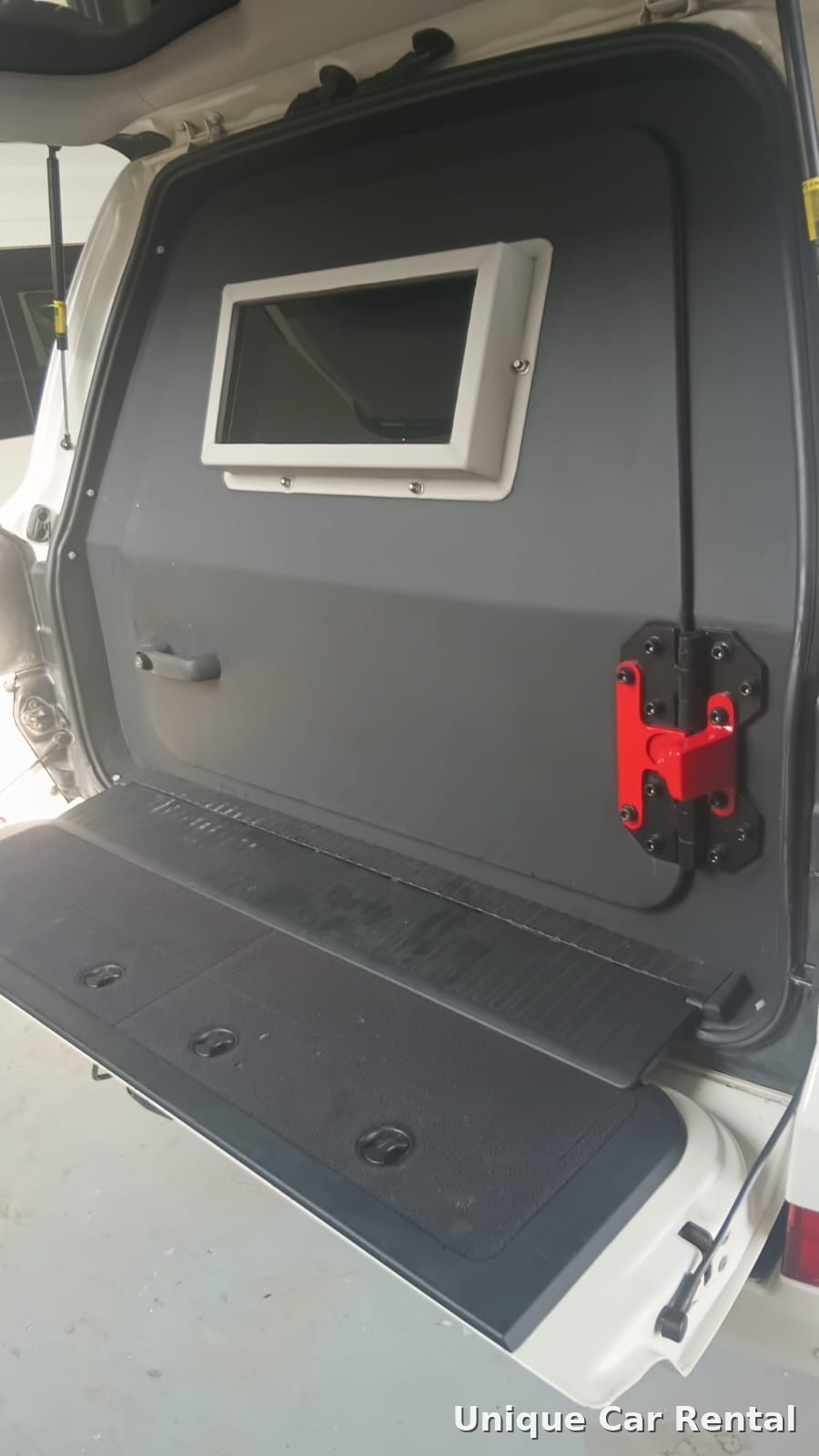 Armored SUV rear door with ballistic glass window and heavy latch