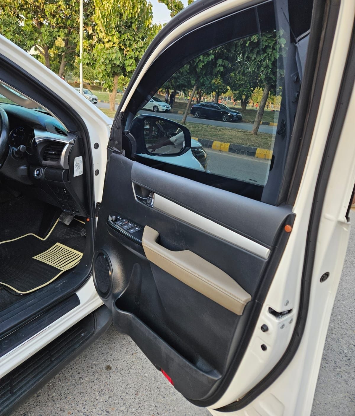Bulletproof Toyota Hilux Revo for rent in Lahore - front door interior