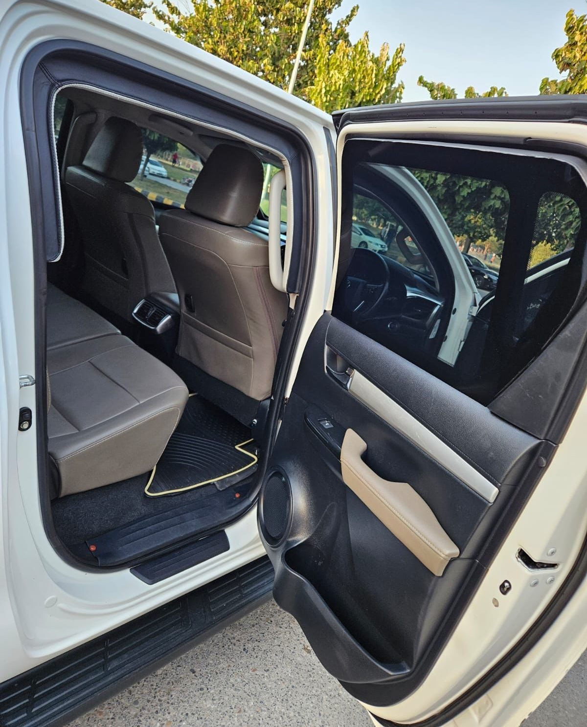 Bulletproof Toyota Hilux Revo for rent in Lahore - rear door interior