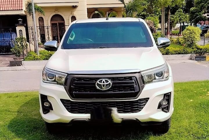 Bulletproof Toyota Hilux Revo for rent in Lahore - rocco white front view