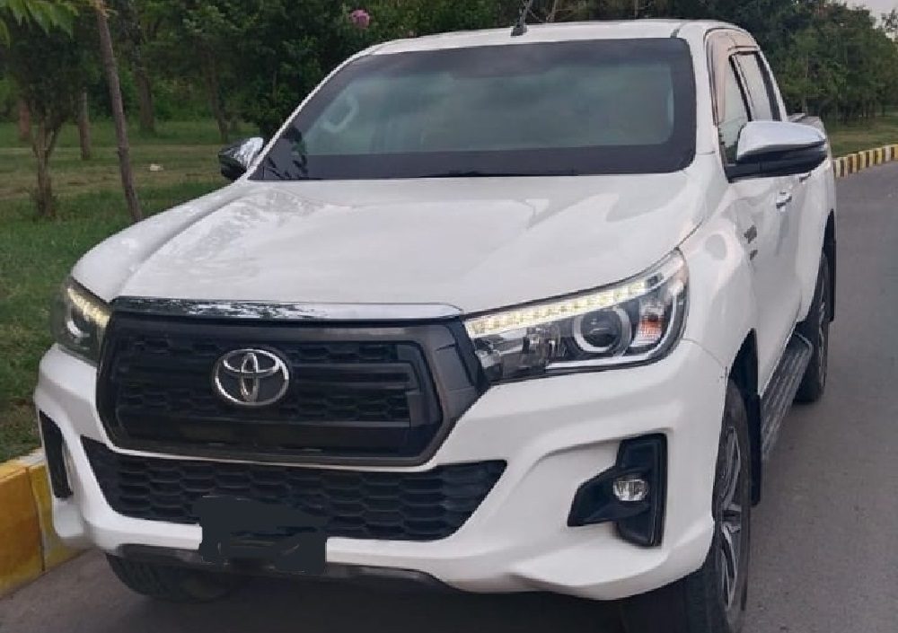 Bulletproof Toyota Hilux Revo for rent in Lahore - rocco white front