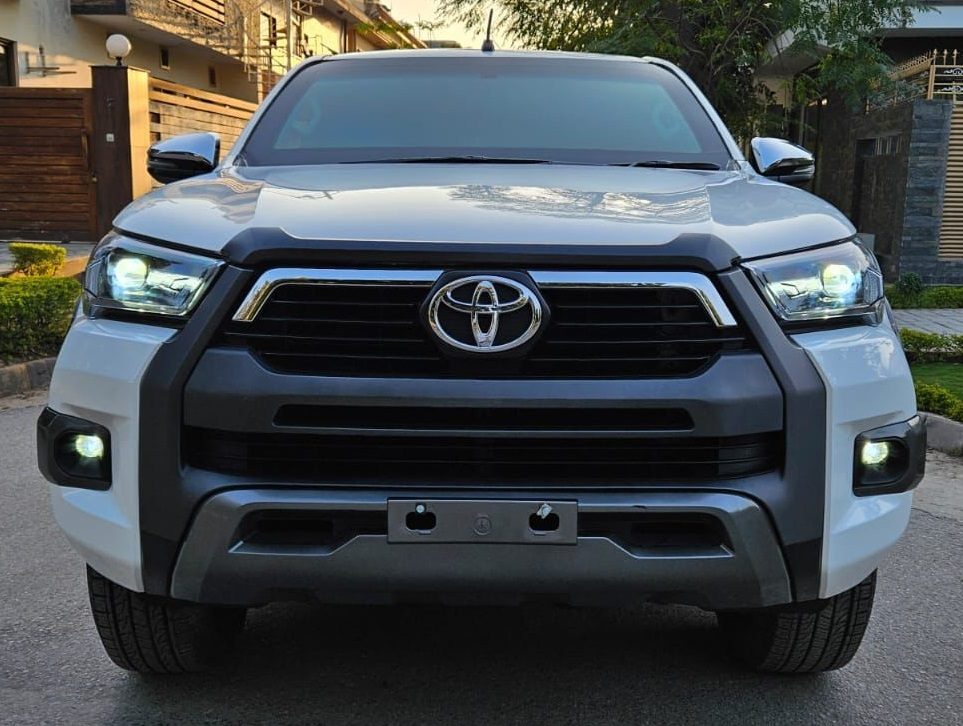 Bulletproof Toyota Hilux Revo for rent in Lahore - white front lights