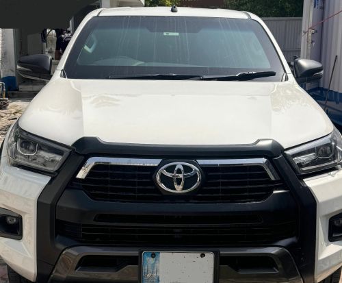 Bulletproof Toyota Hilux Revo for rent in Lahore - white front