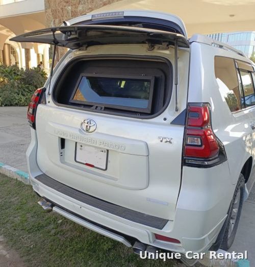 White armored Toyota Land Cruiser Prado TX with ballistic rear window