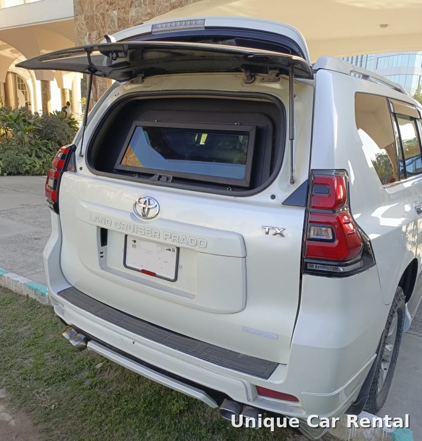 White armored Toyota Land Cruiser Prado TX with ballistic rear window