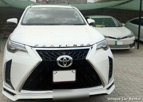 Toyota Fortuner white front close-up for rent in Islamabad