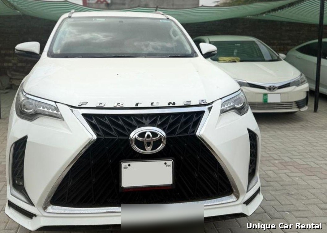 Toyota Fortuner white front close-up for rent in Islamabad