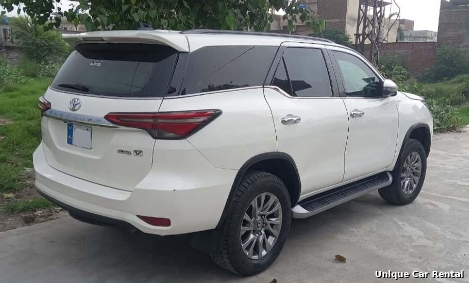Toyota Fortuner white rear three-quarter view for rent in Islamabad