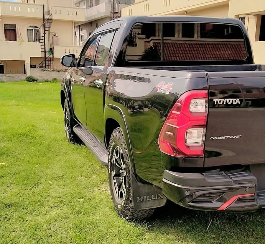 Toyota Hilux Revo for rent in Lahore - black rear side