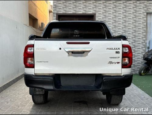 White Toyota Hilux Revo pickup rear view