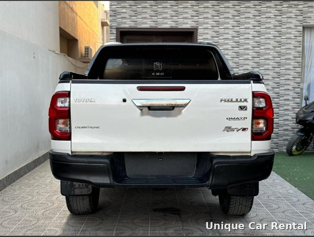 White Toyota Hilux Revo pickup rear view