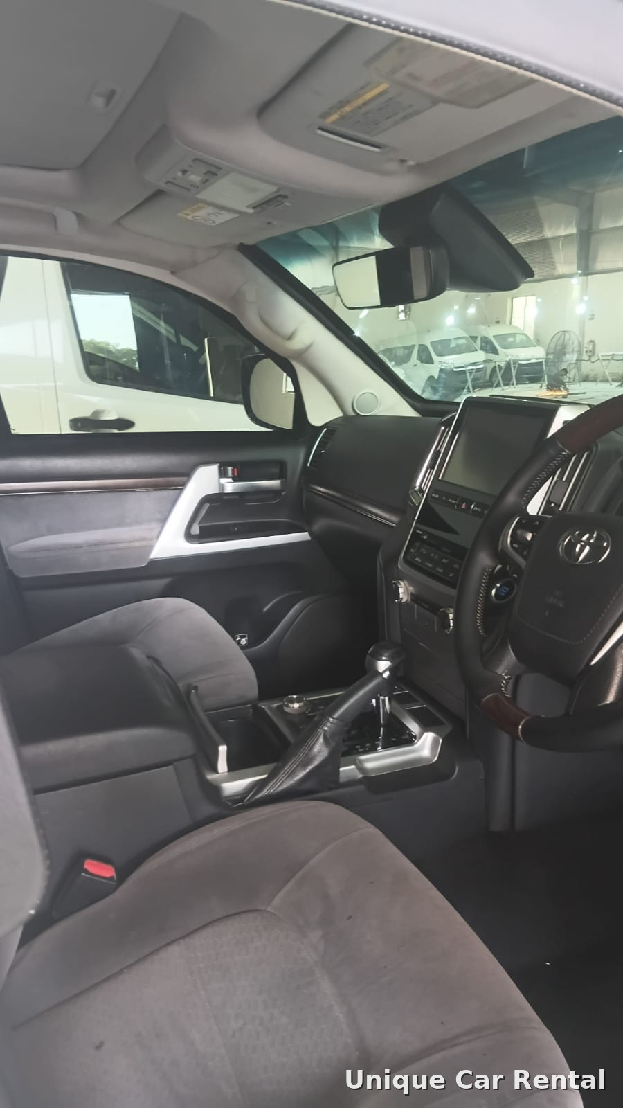 Toyota Land Cruiser 200 interior dashboard with touchscreen and gear shifter