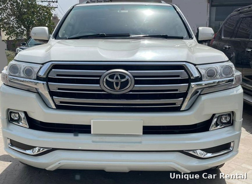 White Toyota Land Cruiser 200 front grille and headlights close-up