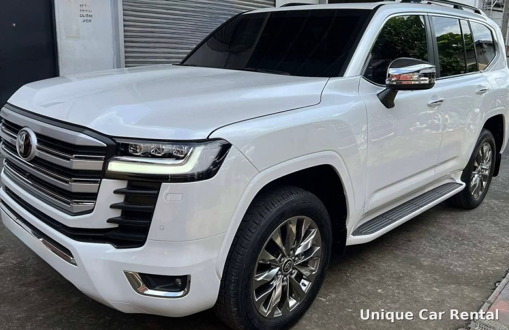 White Toyota Land Cruiser 300 front three-quarter view