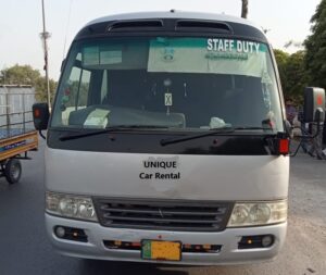 Coaster rental with professional driver service in Lahore