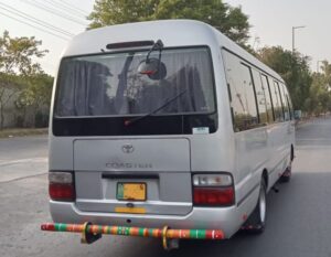 Coaster available for rent in Lahore for group travel and event