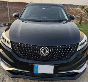 SUV black exterior side profile parked in city
