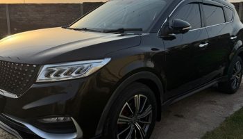 a3f08adc-6967-4f85-b239-67dc5fadcadd Interior dashboard of DFSK Glory with smart infotainment system