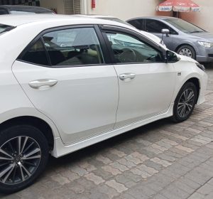 Toyota Corolla Altis 1.8 White available for rent with driver in Lahore