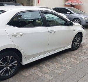 Toyota Corolla Altis 1.8 White available for rent with driver in Lahore