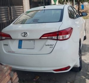 Toyota Corolla dark grey color side profile for rent in Lahore