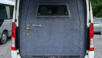 Black bulletproof Grand Cabin van parked at Islamabad Airport